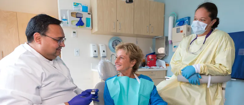 A staff member completes patient paperwork