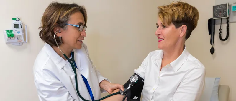 Two nurses in an exam room