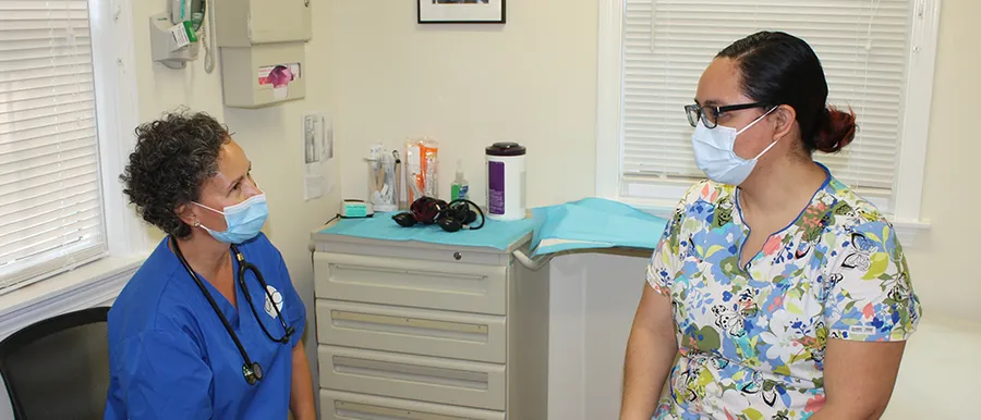 A provider checks a patient's blood pressure
